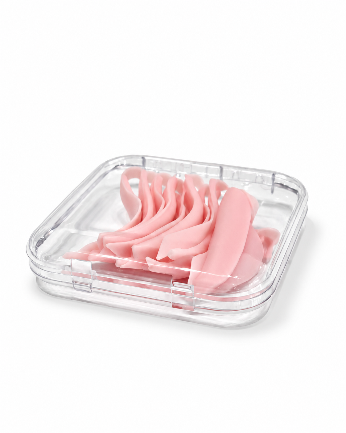 Caja acrílica transparente de 75 × 75 mm cerrada, con moldes rosas de lifting visibles a través de la tapa.