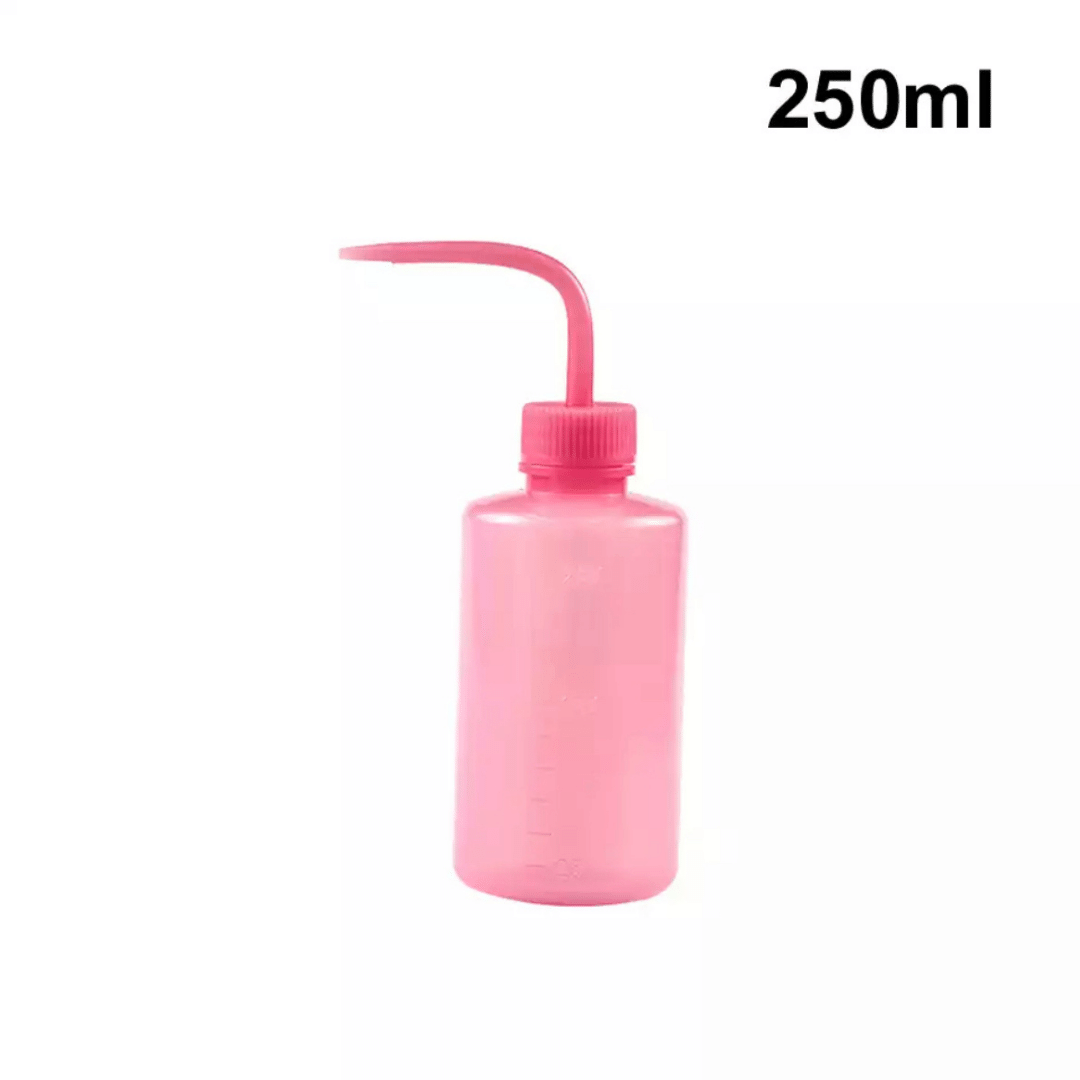 Botella 250 ml plastica para lavar las pestañas. Color rosa