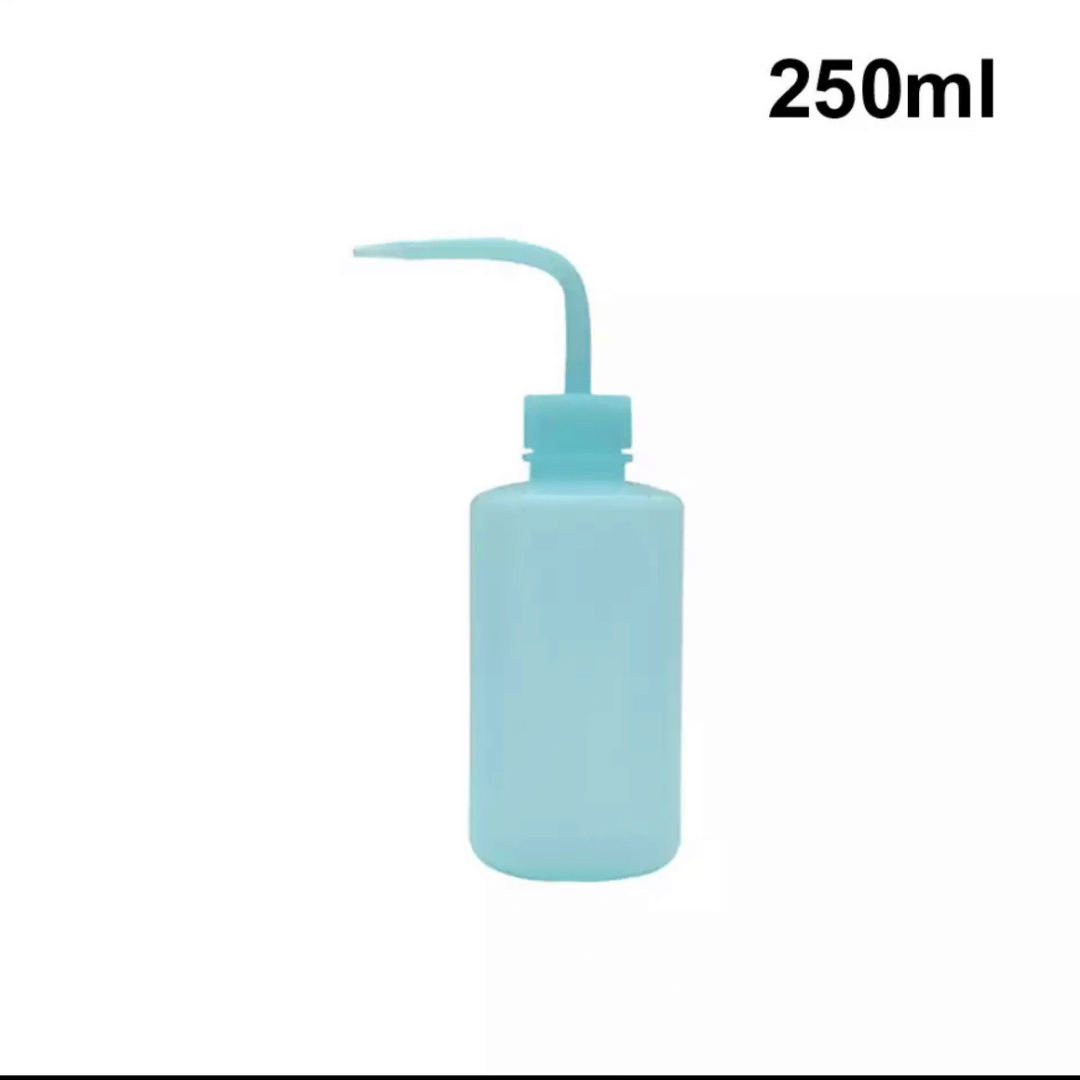 Botella 250 ml plastica para lavar las pestañas. Color azul